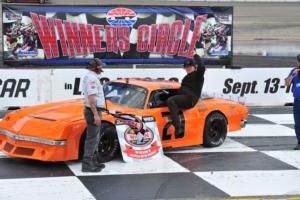 Sam Jacks joined his younger brother, Kyle, in the Winner's Circle at The Bullring's season-opener on Sunday.