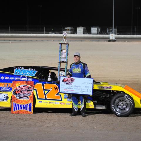 Jason Hughes from Watts, Okla., added his name to the list of Duel in the Desert winners after taking the IMCA Modifieds Main Event title on Saturday night.