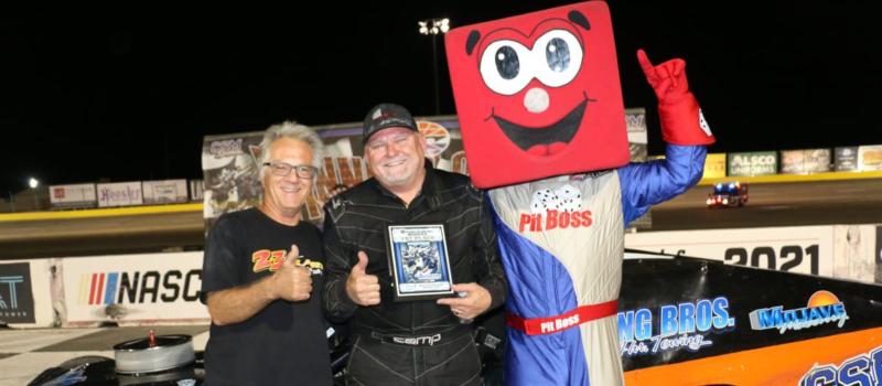 Doug Hamm was one of many Bullring champions this year. He celebrates his title with Bullring director T.J. Clark and Pit Boss.