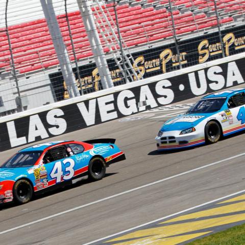 Jeremy Roenick (white No. 43) drafts with NASCAR driver Brendan Gaughan as they make their way around Las Vegas Motor Speedway on Wednesday morning.