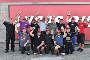 Champions from the spring NHRA Division 7 Lucas Oil Drag Racing Series event at The Strip at LVMS pose with Strip Director Jeff Foster (left) and Division 7 Director Mike Rice (right).