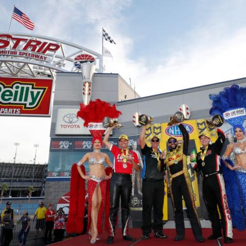 NHRA Toyota Nationals winners (from l to r): Hector Arana Jr., Bo Butner, J.R. Todd and Steve Torrence celebrate with Vegas showgirls at The Strip at LVMS.